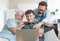 Intergenerational group around a computer